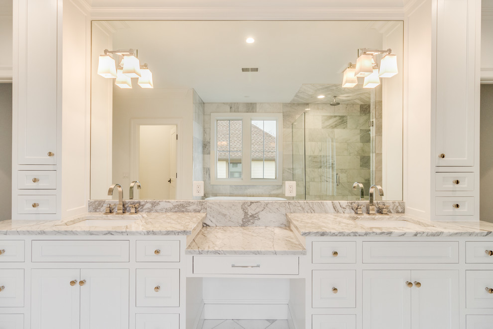 Design ideas for a transitional master bathroom in Detroit with shaker cabinets, white cabinets, a freestanding tub, an alcove shower, gray tile, metal tile, white walls, marble floors, an undermount sink, marble benchtops, grey floor, a hinged shower door and grey benchtops.