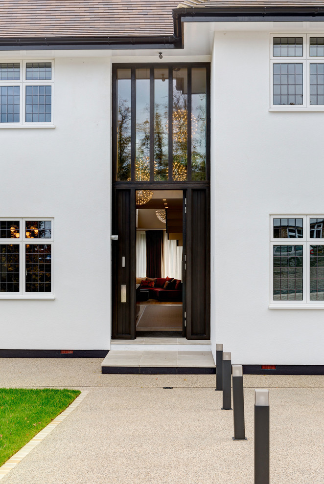 Design ideas for a transitional front door in London with a single front door.
