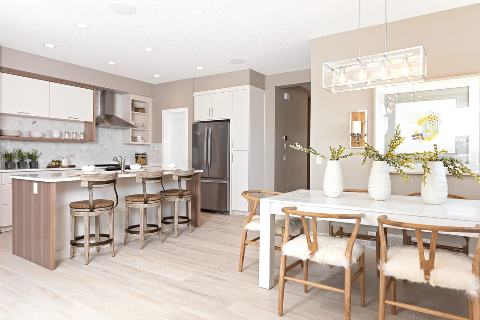 Example of a transitional home design design in Calgary