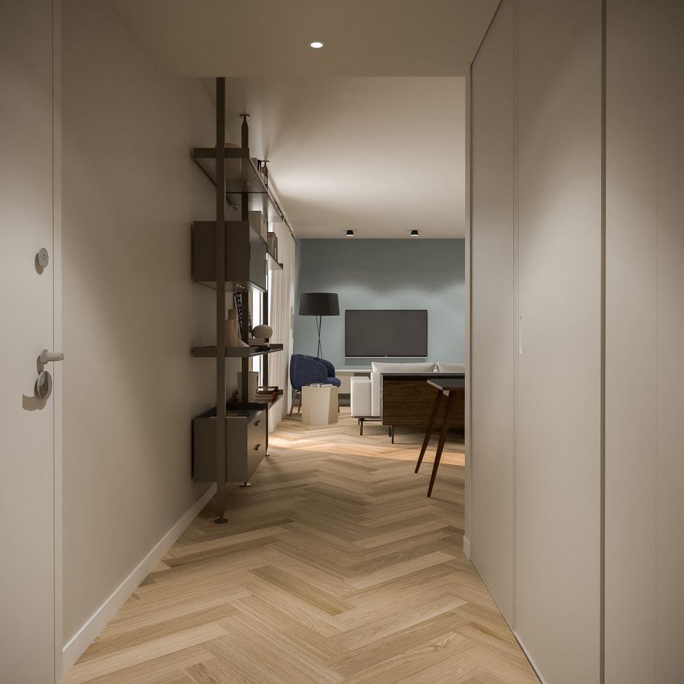 Photo of a mid-sized modern foyer in Milan with beige walls, light hardwood floors, a single front door and a white front door.