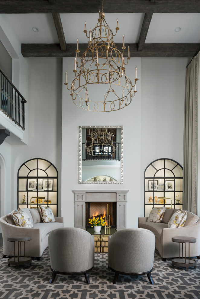 This is an example of a mediterranean open concept living room in Detroit with white walls and a standard fireplace.