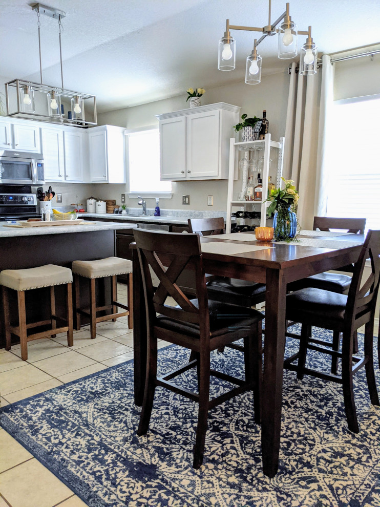 Eat-in kitchen - mid-sized transitional l-shaped ceramic tile, beige floor and vaulted ceiling eat-in kitchen idea with a double-bowl sink, raised-panel cabinets, light wood cabinets, laminate countertops, stainless steel appliances, an island and gray countertops