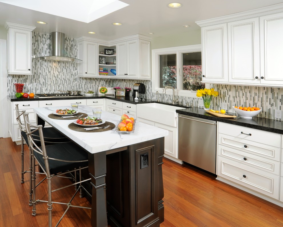 Photo of a contemporary kitchen in Sacramento with white cabinets, grey splashback and matchstick tile splashback.