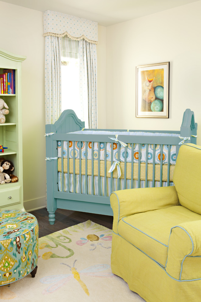 Photo of a traditional gender-neutral nursery in Los Angeles with beige walls and dark hardwood floors.