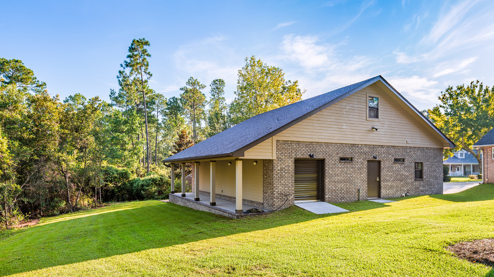Huge transitional detached three-car home design photo
