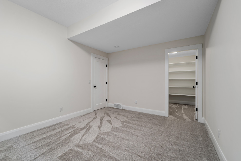 Example of a transitional home design design in Calgary