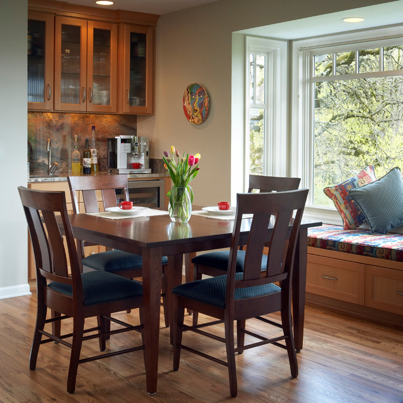 Example of a classic medium tone wood floor kitchen/dining room combo design in Portland