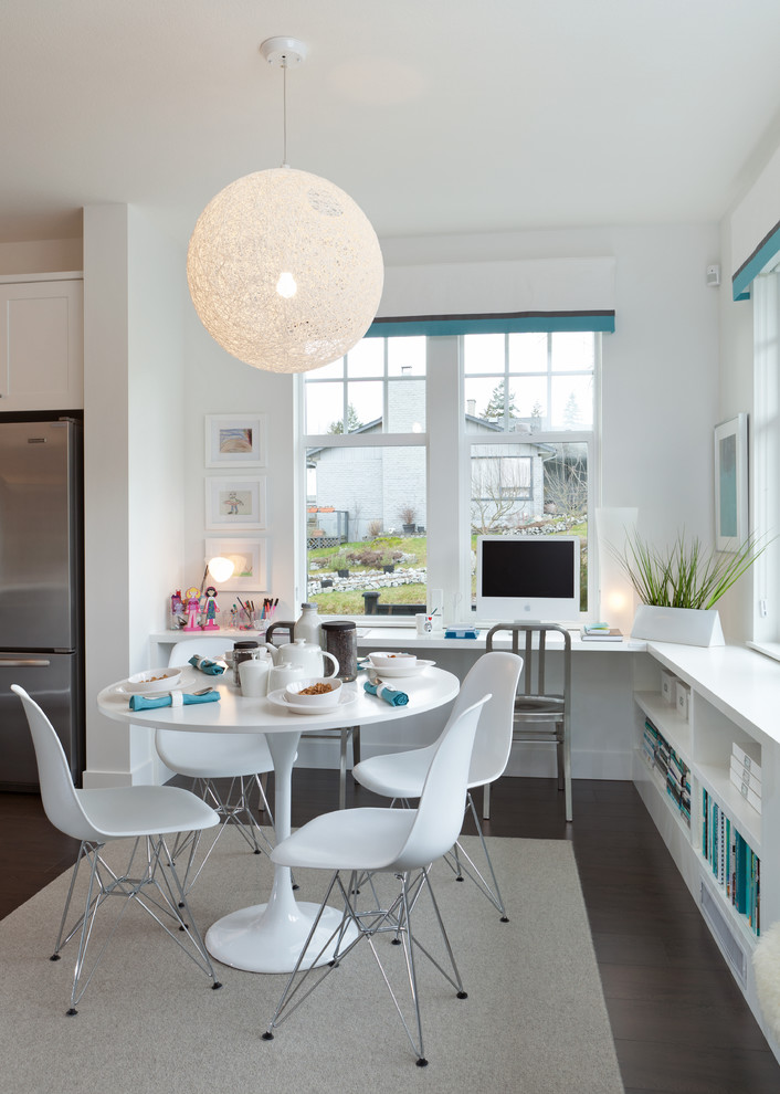 This is an example of a contemporary eat-in kitchen in Vancouver with shaker cabinets, white cabinets and stainless steel appliances.