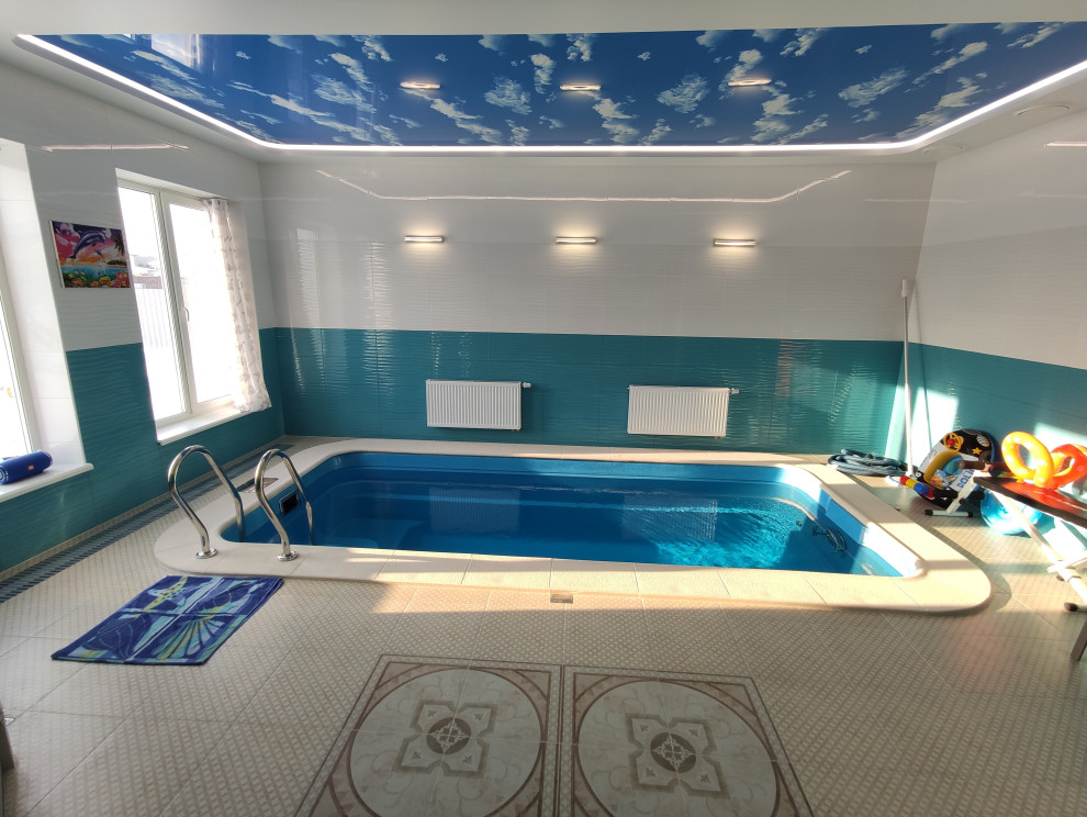 Photo of a medium sized beach style indoor swimming pool in Yekaterinburg.