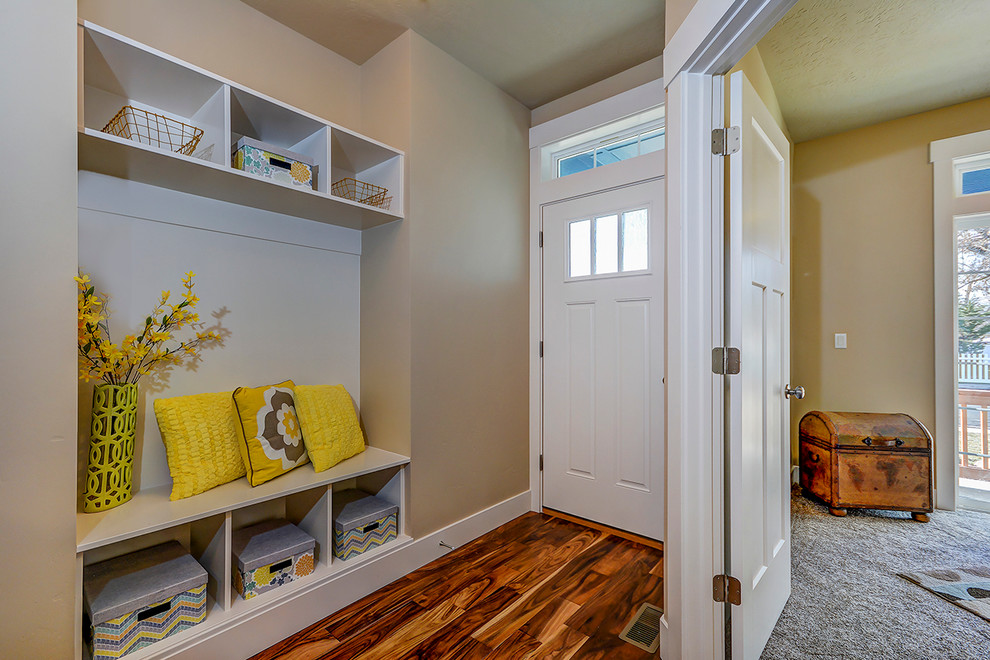 Inspiration for a traditional mudroom in Boise with beige walls, medium hardwood floors, a single front door and a white front door.