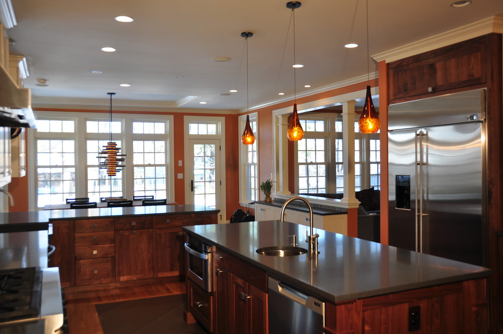 Inspiration for a large transitional u-shaped dark wood floor eat-in kitchen remodel in Boston with a farmhouse sink, flat-panel cabinets, dark wood cabinets, granite countertops, gray backsplash, mosaic tile backsplash, stainless steel appliances and an island