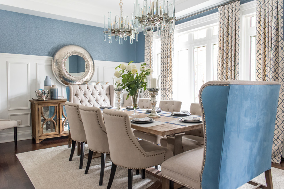 Inspiration for a large transitional medium tone wood floor and brown floor enclosed dining room remodel in Toronto with blue walls and no fireplace