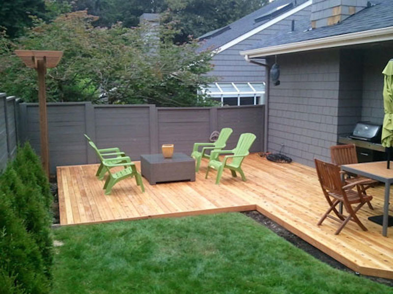 Mid-sized backyard deck photo in Seattle with no cover