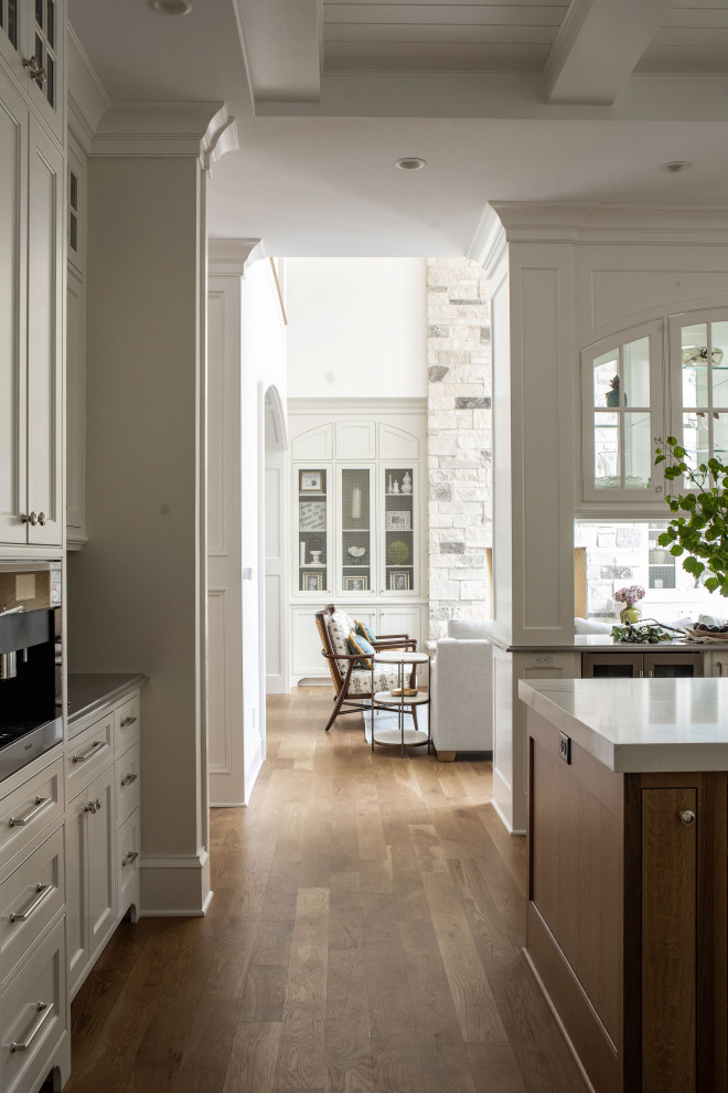 Grand Haven Custom Home - A true grand haven custom build for a family of five. Their desire for a retreat and openness to creative use of color lends a uniqueness to this traditional cape-cod style home. White oak flooring set the stage for custom cabinetry throughout.