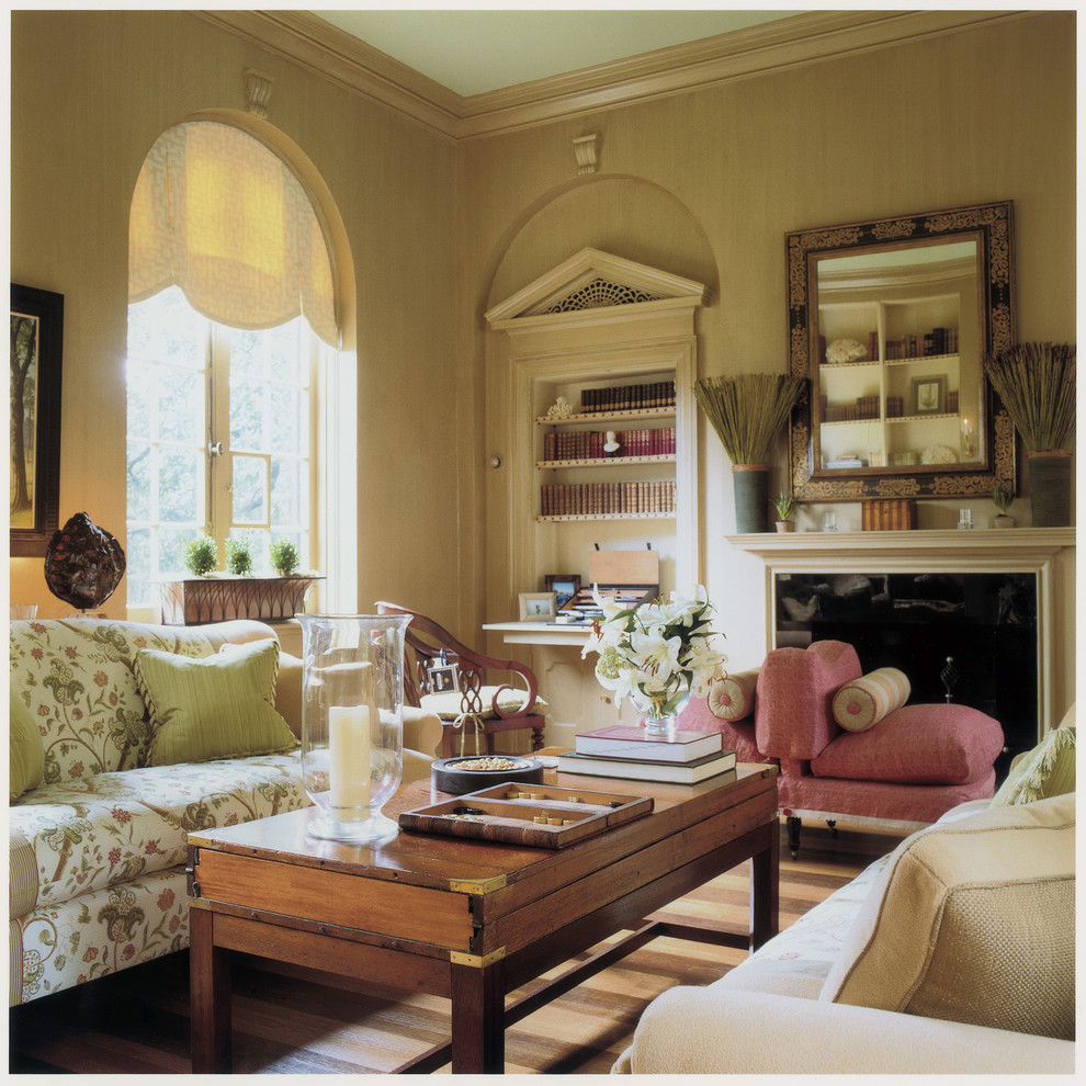 This is an example of a traditional family room in DC Metro with beige walls.