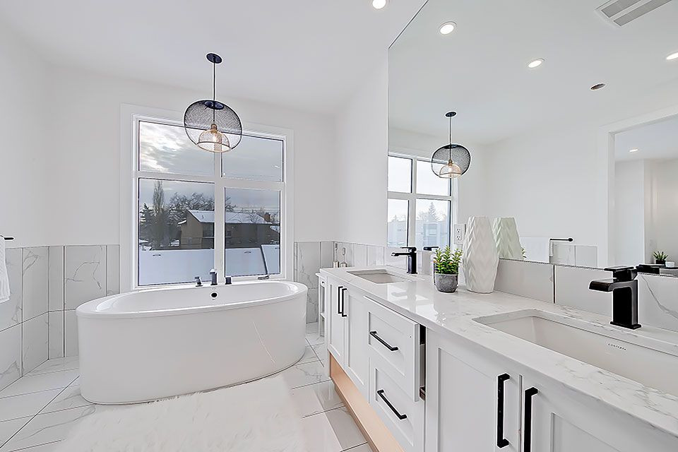 Example of a transitional home design design in Calgary