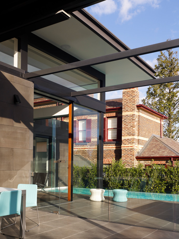 Design ideas for a contemporary brick exterior in Melbourne.