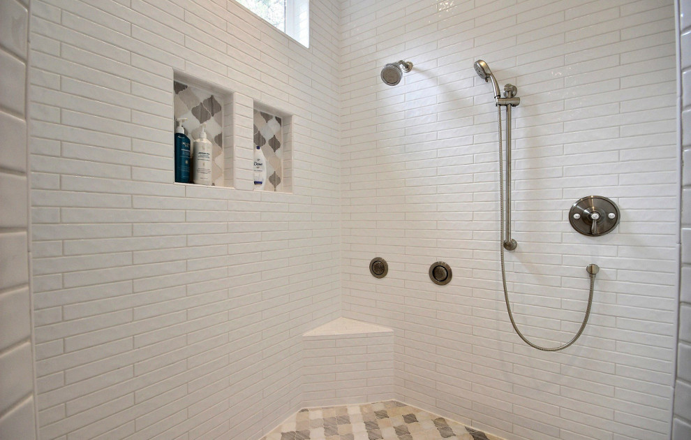 Inspiration for an expansive arts and crafts master bathroom in Portland with recessed-panel cabinets, white cabinets, a freestanding tub, an alcove shower, a bidet, multi-coloured tile, ceramic tile, beige walls, ceramic floors, an undermount sink, engineered quartz benchtops, beige floor, an open shower, white benchtops, a niche, a double vanity and a built-in vanity.