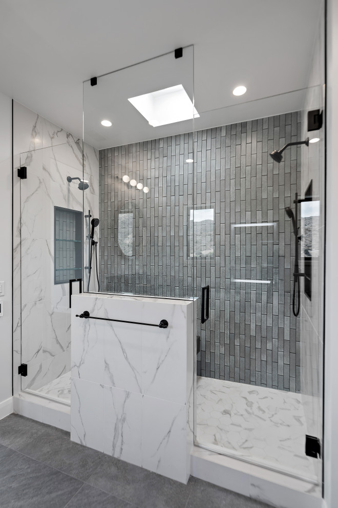 Expansive country master bathroom in Los Angeles with a double shower, white walls, cement tiles, grey floor and a hinged shower door.