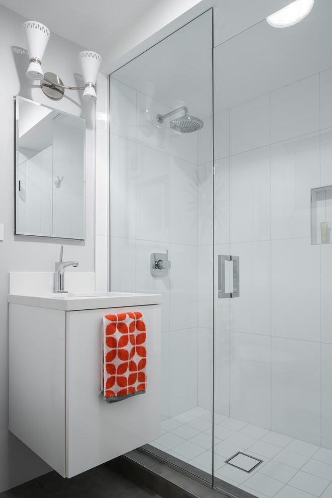 Small midcentury 3/4 bathroom in Other with flat-panel cabinets, white cabinets, an open shower, a one-piece toilet, white tile, ceramic tile, grey walls, cement tiles, an undermount sink, engineered quartz benchtops, grey floor, a hinged shower door and white benchtops.