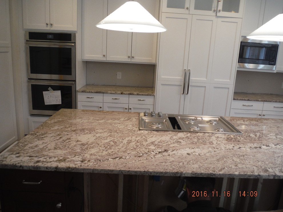 Inspiration for a mid-sized transitional single-wall eat-in kitchen remodel in Baltimore with shaker cabinets, white cabinets, granite countertops and an island