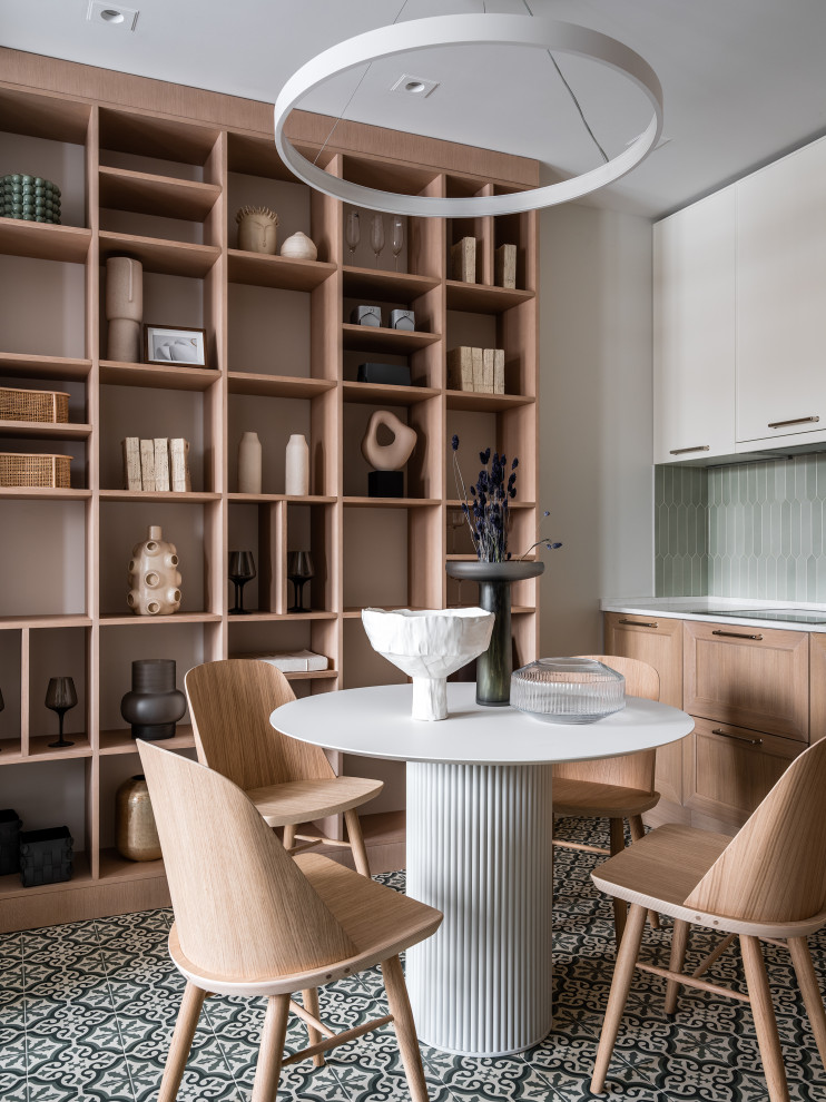 Eat-in kitchen - small contemporary l-shaped porcelain tile and green floor eat-in kitchen idea in Moscow with an undermount sink, flat-panel cabinets, medium tone wood cabinets, quartz countertops, green backsplash, ceramic backsplash, black appliances and white countertops