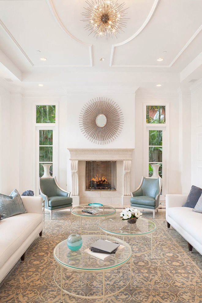 Photo of a traditional formal living room in Miami with white walls and a standard fireplace.