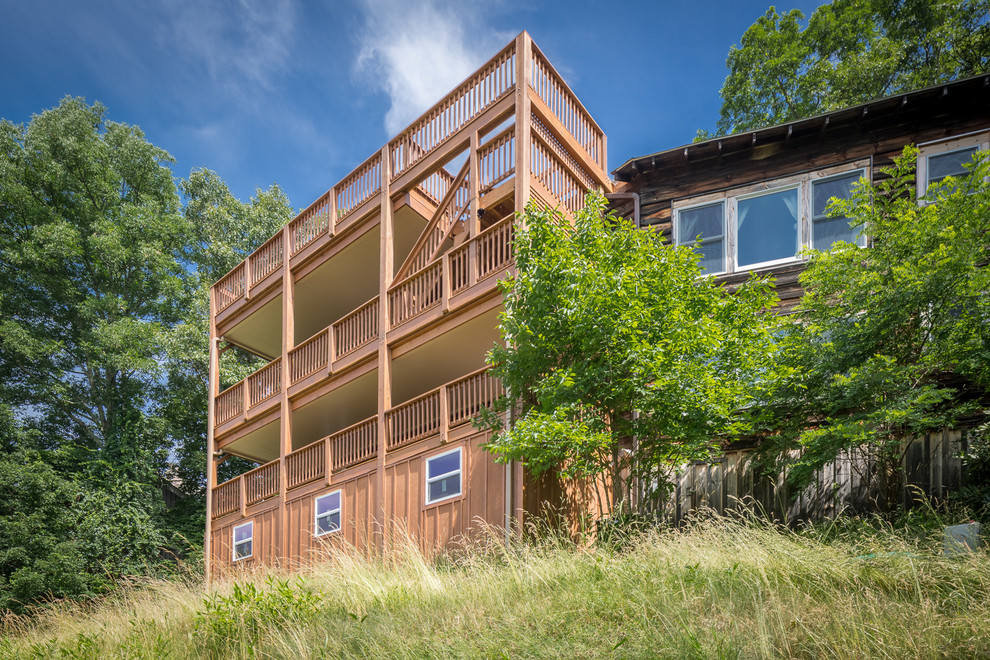 Example of a huge mountain style rooftop deck design in Charlotte