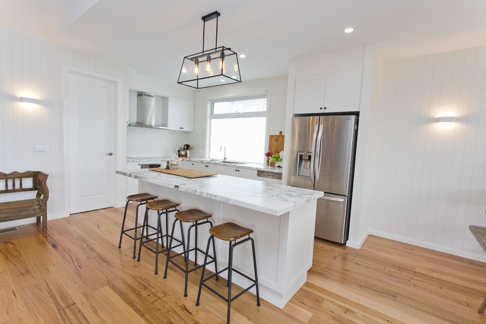 This is an example of a beach style kitchen in Melbourne.