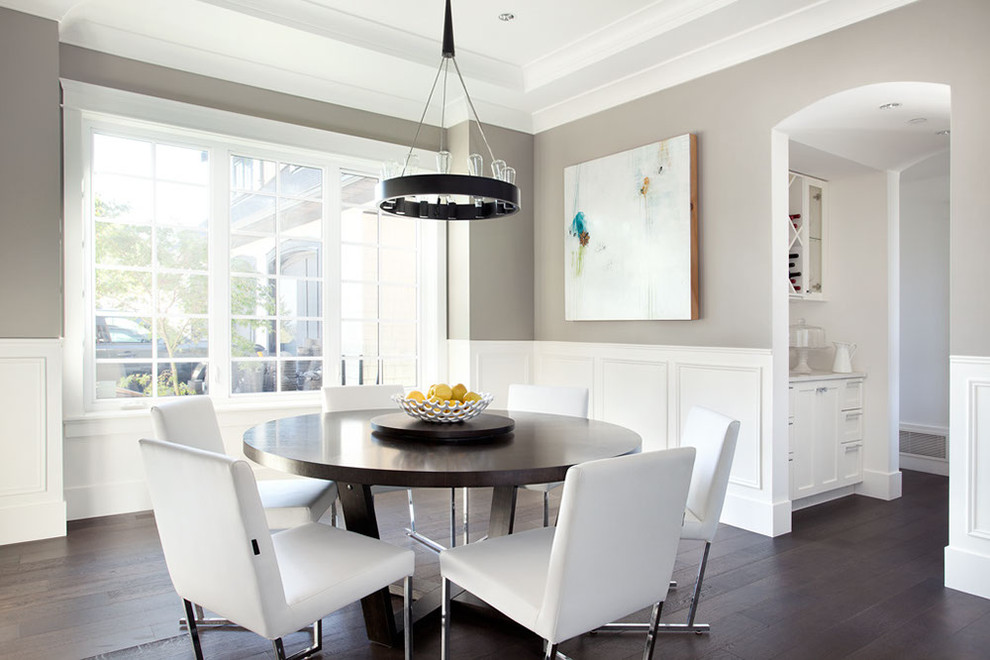 Contemporary dining room in Vancouver with grey walls and dark hardwood floors.