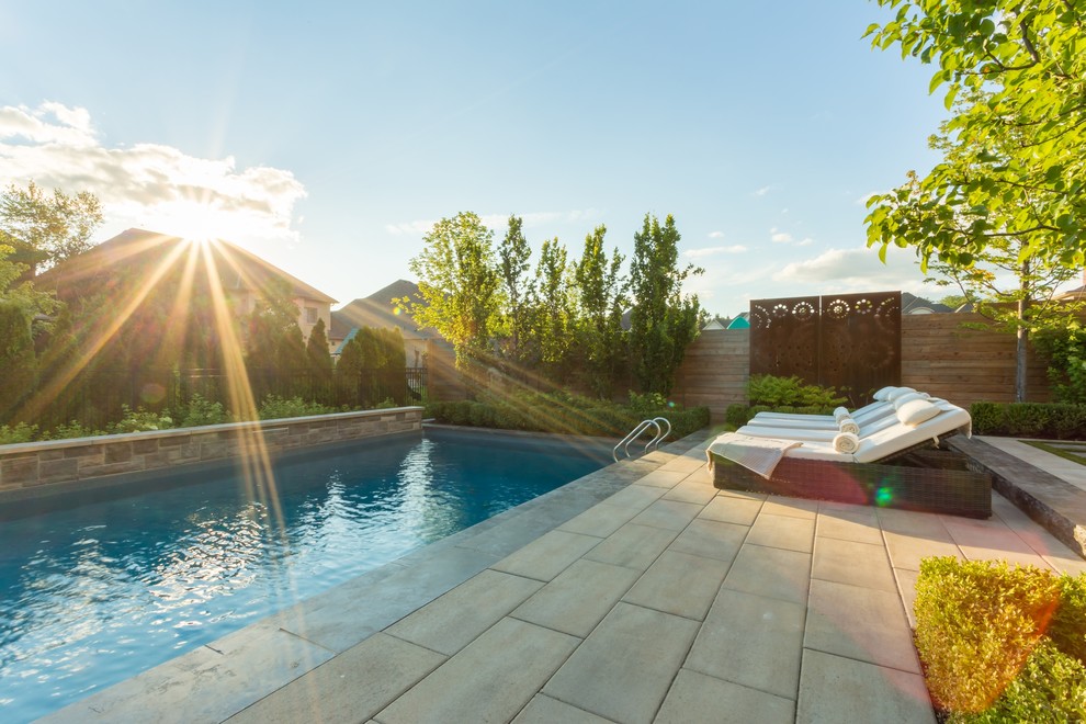 This is an example of a transitional backyard landscaping in Toronto.