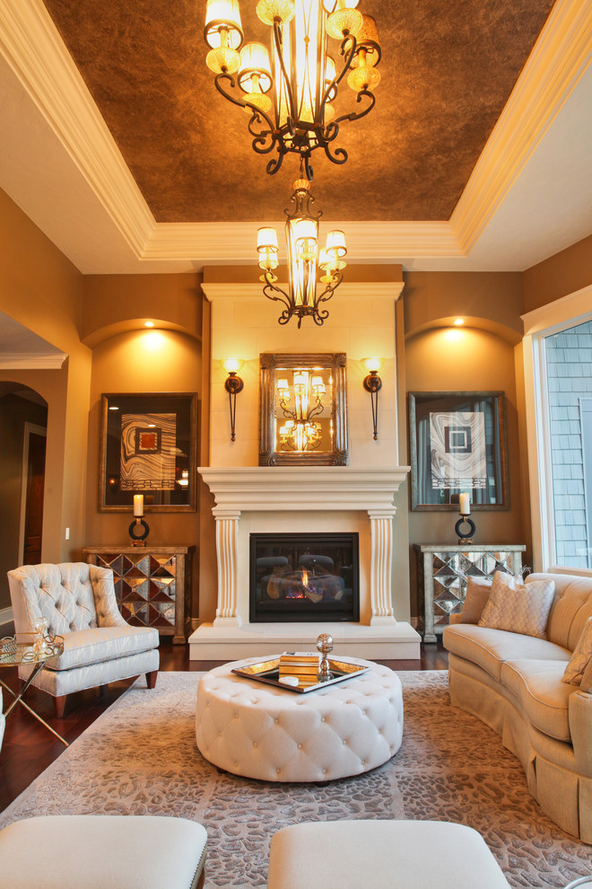 Photo of a traditional formal living room in Chicago with brown walls, dark hardwood floors and a standard fireplace.
