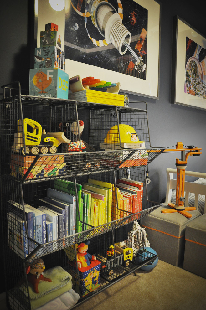 Astronomer's Observatory - A Child's Room - This navy kid's room is filled with bright moments of orange and yellow. Ralph Lauren's Northern Hemisphere is covering the ceiling, inspiring exploration in space and ocean.  A Solar System mobile and light-up Moon provide great fun to this sophisticated yet playful space.