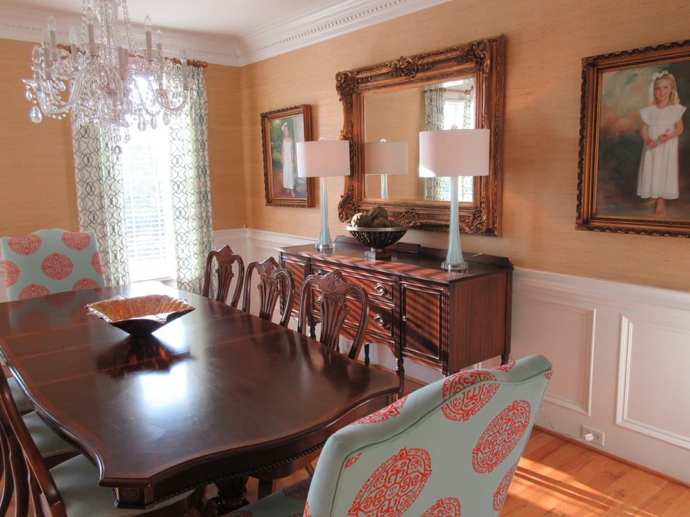 Inspiration for a large transitional light wood floor and brown floor enclosed dining room remodel with beige walls and no fireplace