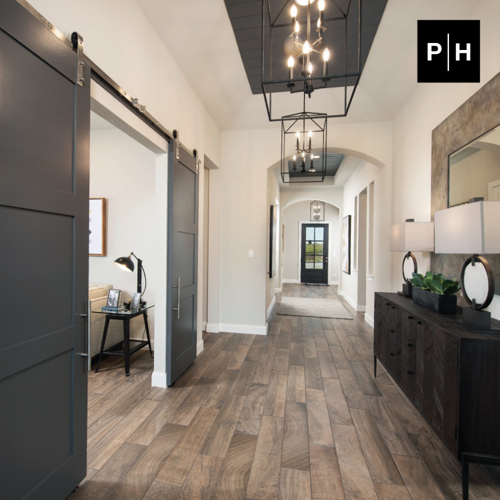 Entry hall - medium tone wood floor and shiplap ceiling entry hall idea with beige walls and a dark wood front door
