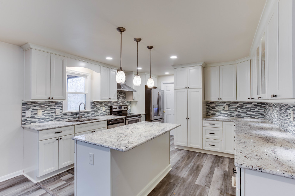 Inspiration for a large transitional u-shaped eat-in kitchen remodel in DC Metro with an undermount sink, granite countertops, stainless steel appliances and an island