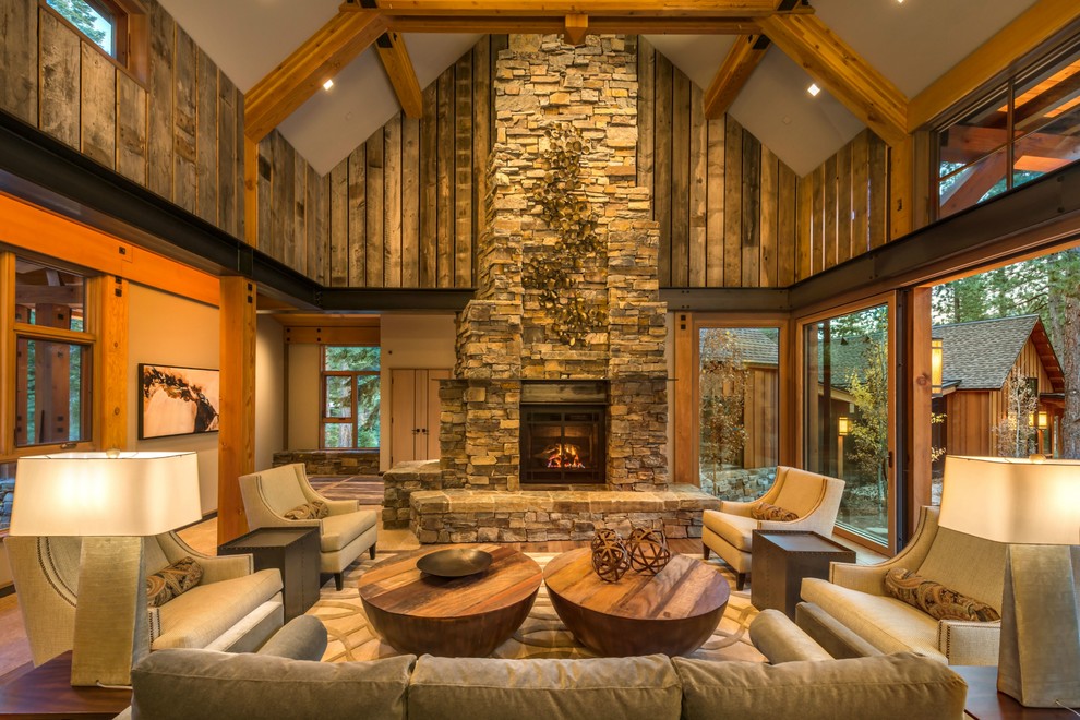 Country enclosed living room in New York with a standard fireplace and a stone fireplace surround.