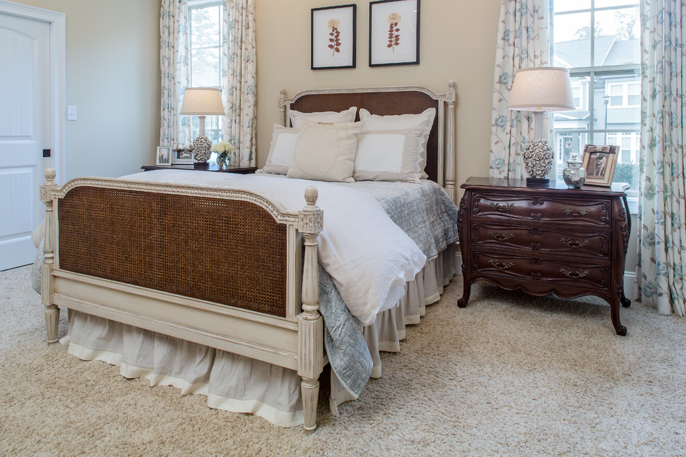 Design ideas for a mid-sized traditional master bedroom in Atlanta with beige walls, carpet, no fireplace and beige floor.