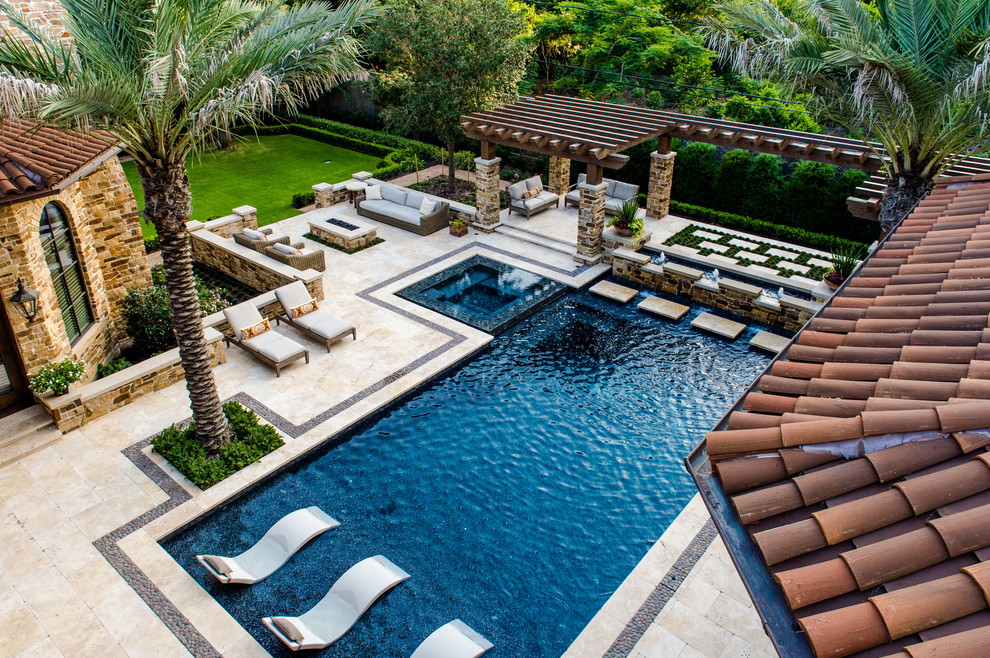 Large tuscan backyard tile and rectangular lap hot tub photo in Houston