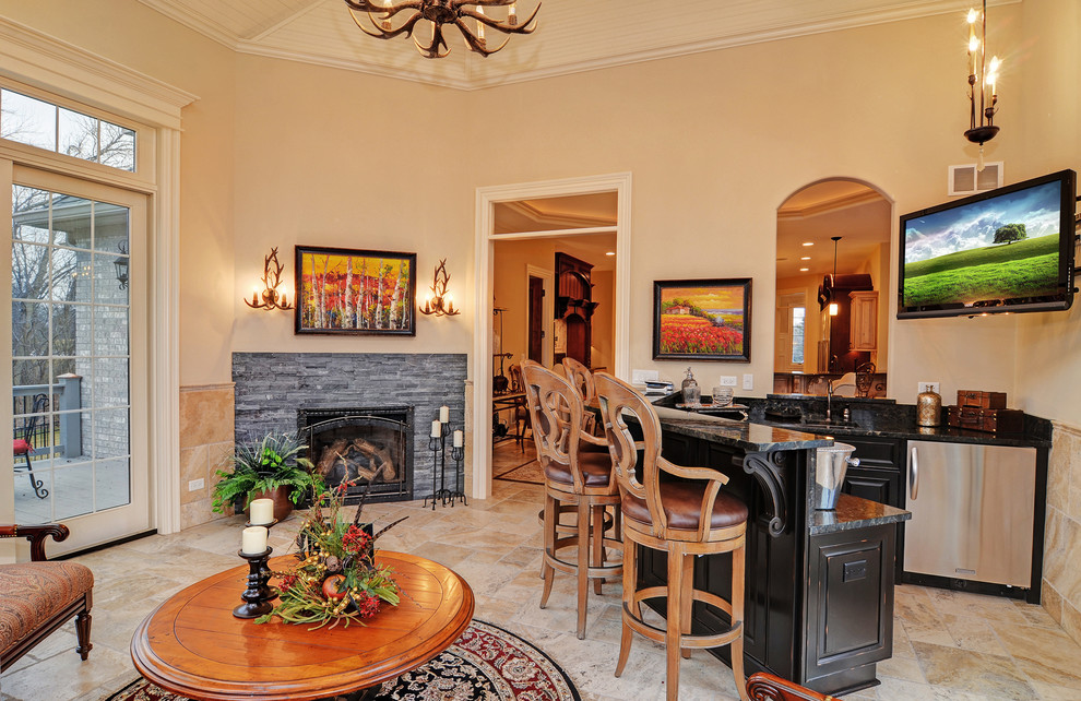 Photo of a traditional family room in Chicago with a home bar, beige walls, a corner fireplace, a stone fireplace surround and a wall-mounted tv.