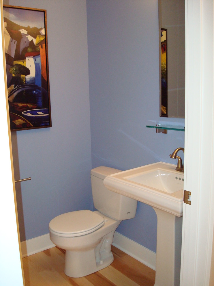 Example of a classic light wood floor powder room design in Grand Rapids with a bidet