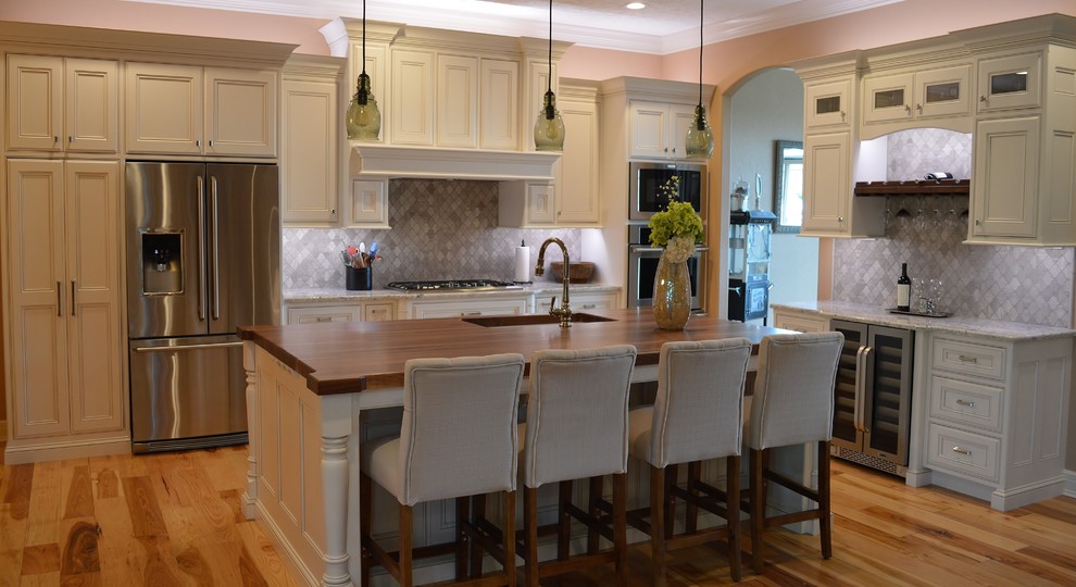 Kitchen - kitchen idea with beaded inset cabinets, gray backsplash and an island