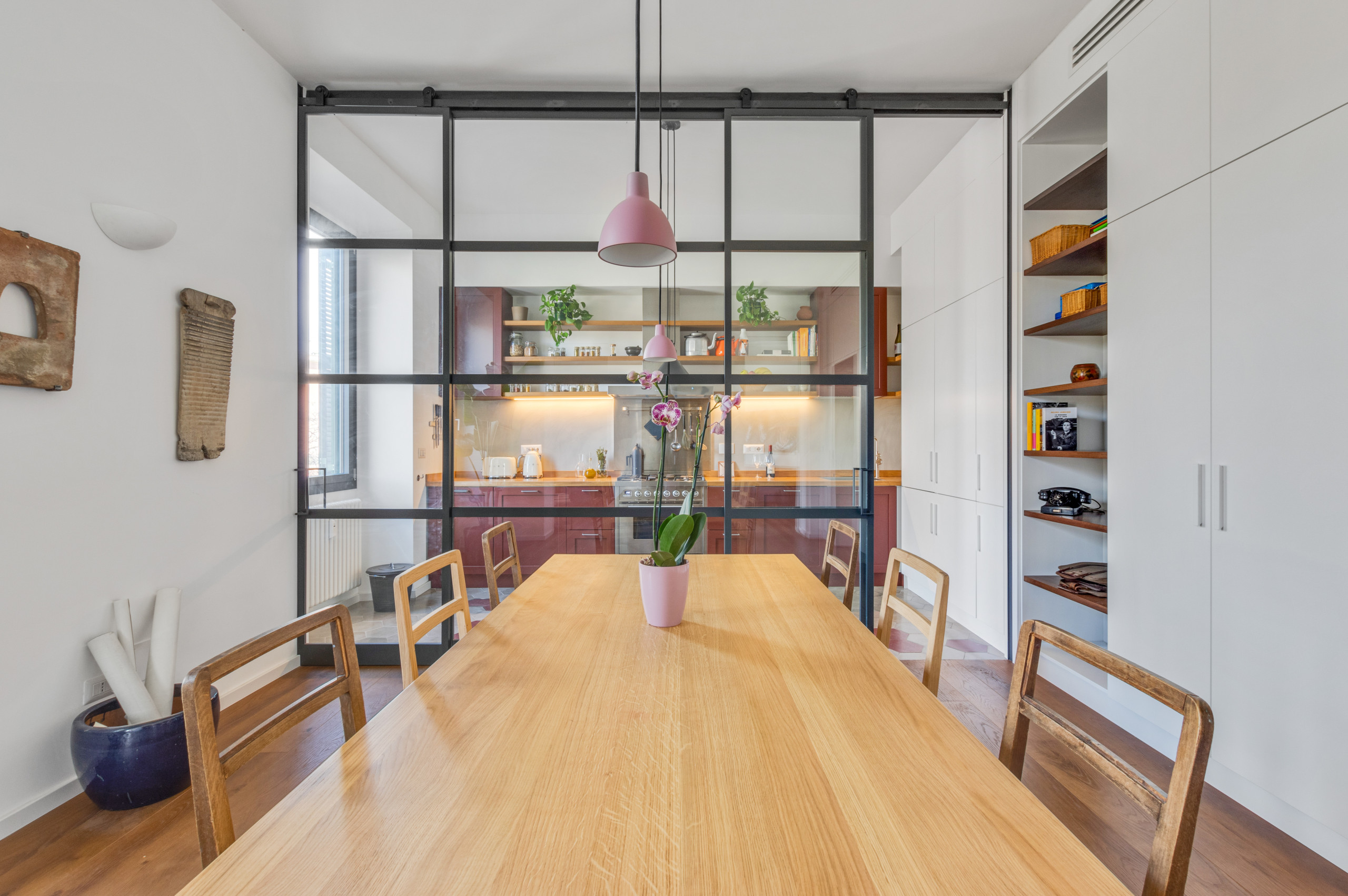 Kitchen/dining room combo - large dark wood floor kitchen/dining room combo idea in Rome with white walls