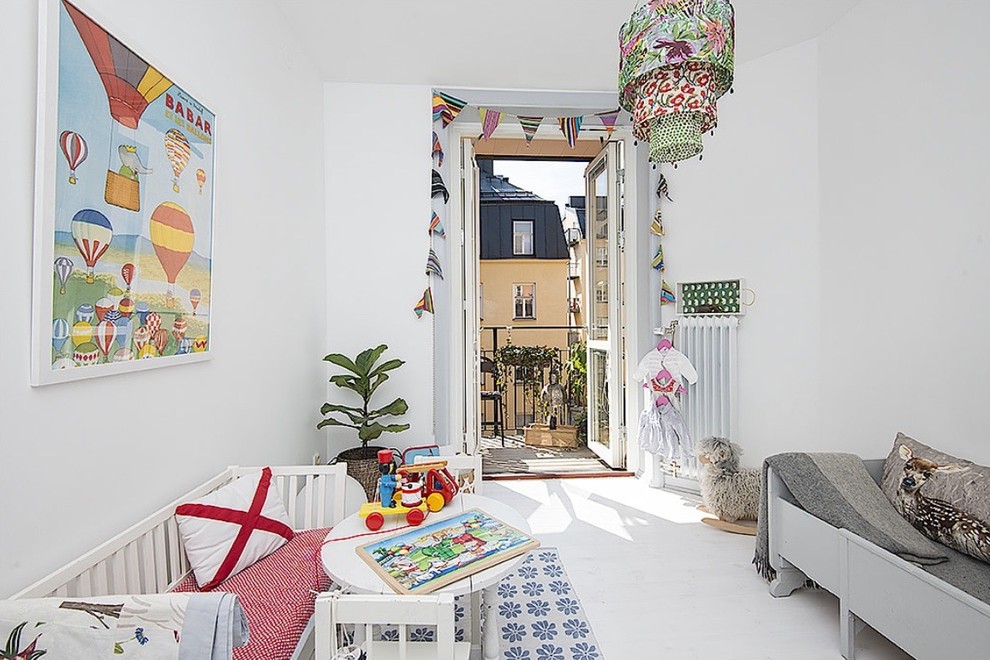 Inspiration for a mid-sized scandinavian gender-neutral kids' room in Stockholm with grey walls and white floor.