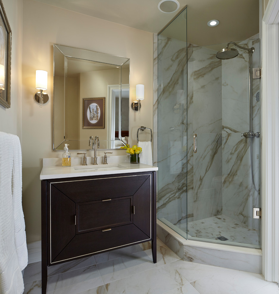 Photo of a small transitional bathroom in Toronto with a corner shower, a one-piece toilet, beige tile, porcelain tile, beige walls, porcelain floors, an undermount sink, quartzite benchtops, beige floor and a hinged shower door.