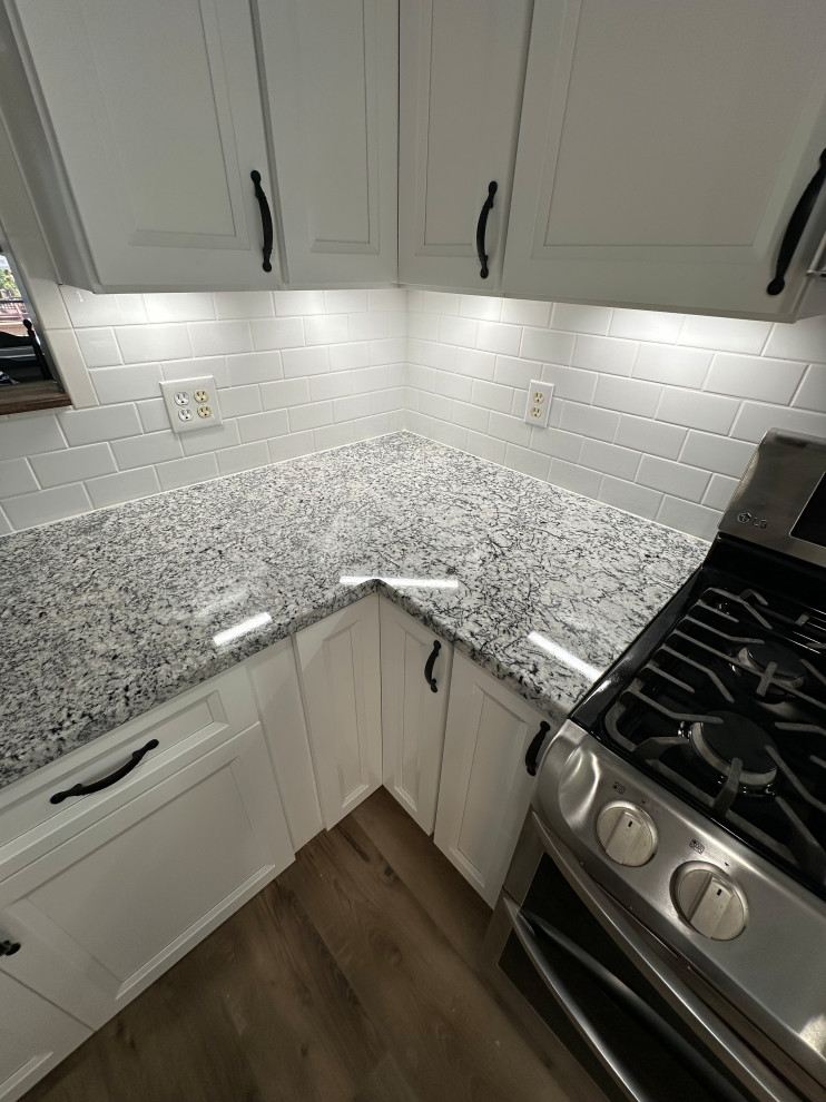 Traditional white subway tile maintains the charm of this farmhouse.