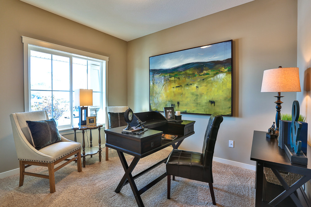 Inspiration for a mid-sized timeless freestanding desk carpeted study room remodel in Minneapolis with beige walls