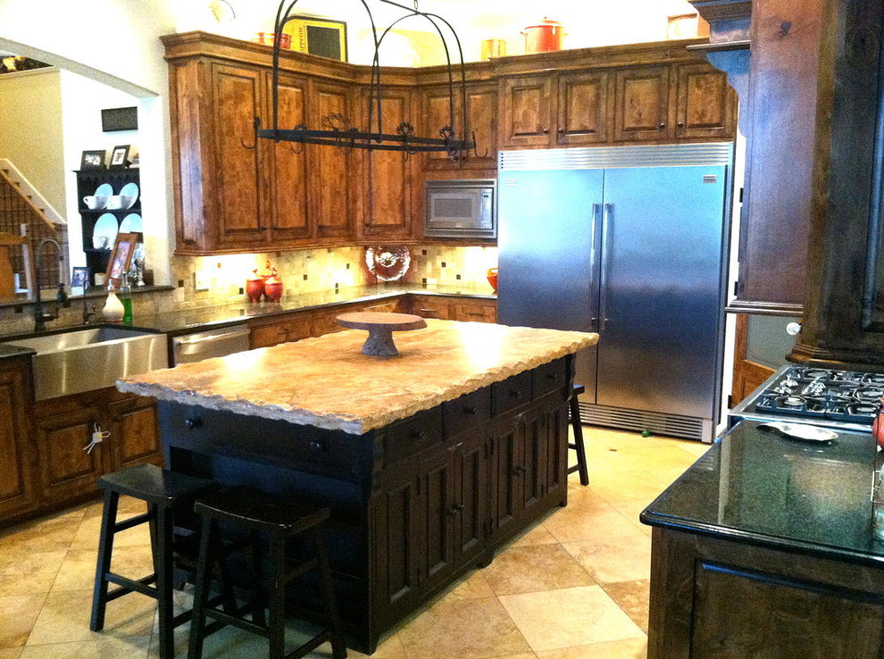 Open concept kitchen - rustic u-shaped open concept kitchen idea in Dallas with beaded inset cabinets and an island