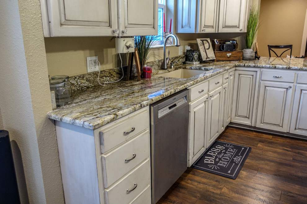 Inspiration for a rustic kitchen remodel in Austin with granite countertops
