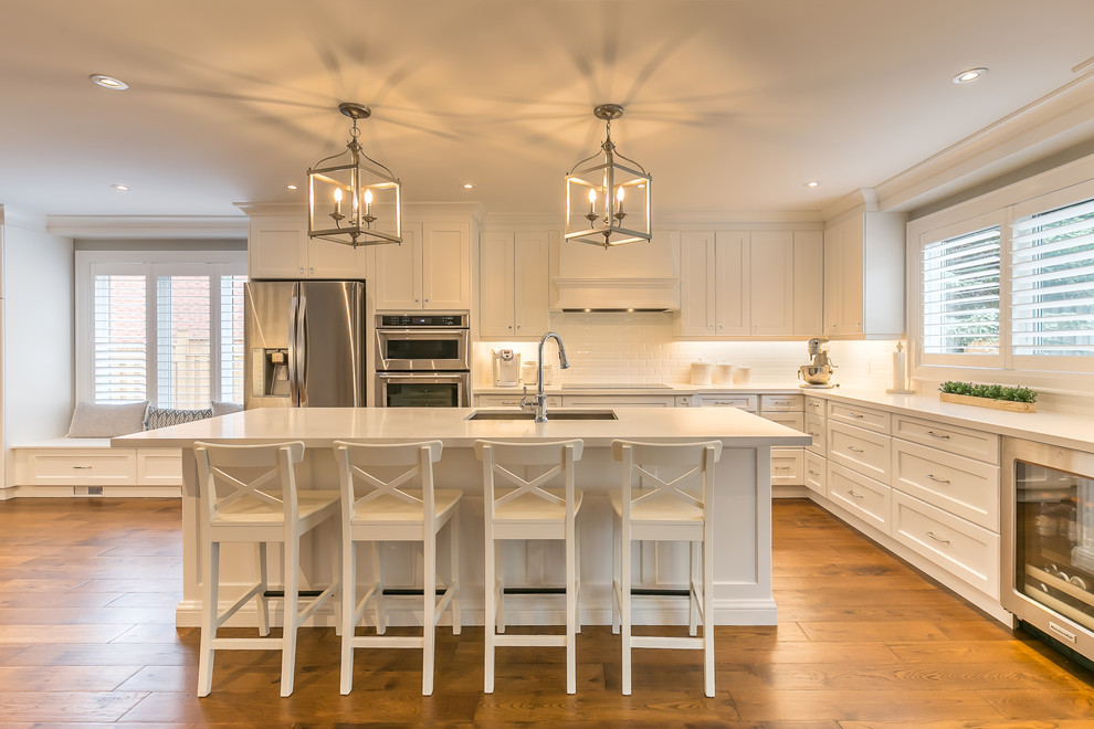 Example of a transitional kitchen design in Toronto